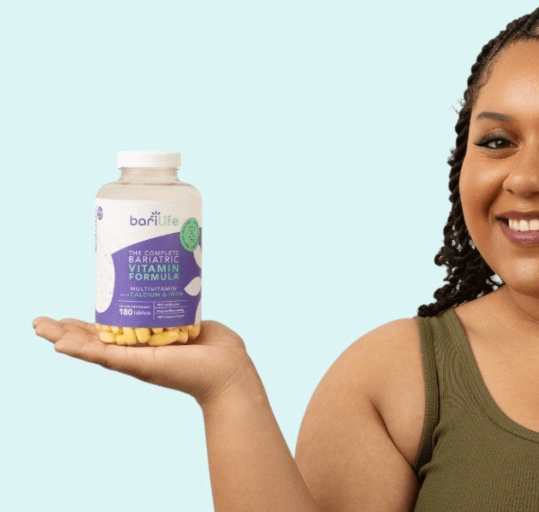 Woman holding Barilife complete bariatric vitamin formula bottle with yellow capsules, promoting health and wellness.